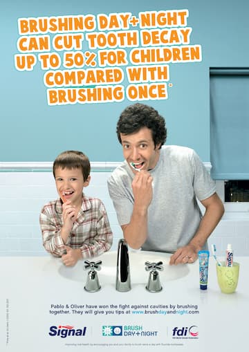 An advertisement with a photo of a man and a boy brushing their teeth